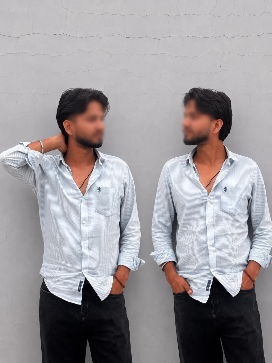 Man posing in a striped shirt with blurred face against a textured wall
